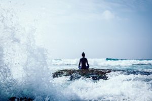 Woman,Meditation,At,The,Seaside,Cliff,Edge,Facing,The,Coming